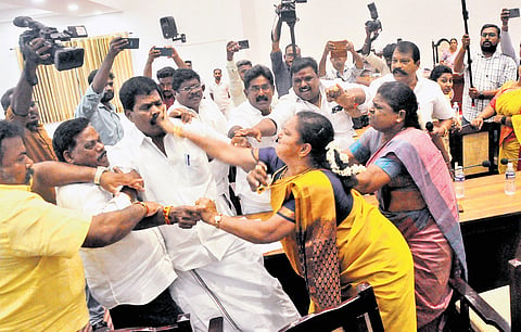 Councillor S Sugashini slaps opposition leader M Yadavamoorthi during the  council meeting of the Salem City Municipal Corporation on Thursday 