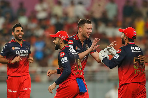 Royal Challengers Bengaluru's Josh Hazlewood celebrates a wicket with teammates during the Indian Premier League qualifier against Punjab Kings 