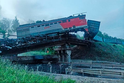 This photo released by Acting Governor of the Kursk Region Alexander Khinshtein telegram channel on Sunday, June 1, 2025, shows a view of a damaged bridge after the crash of a freight train in Russia's Kursk region, which borders Ukraine. 