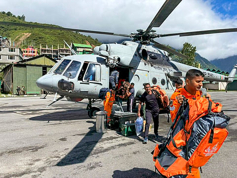 In this image posted by @IAF_MCC via X on June 4, 2025, NDRF personnel and others during a rescue operation of stranded tourists stuck after multiple landslides triggered by heavy rain, in Mangan district, Sikkim. 