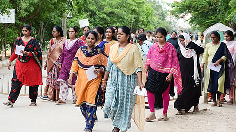 Candidates entering into examination hall to appear Mega DSC examination in Tirupati.