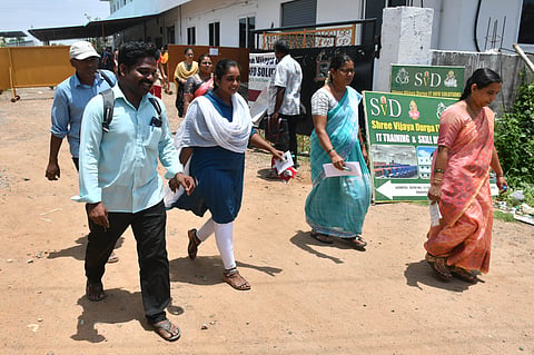 Aspirants come out the exam centre after taking DSC exam at Enikepadu on Friday. 
