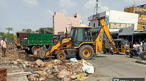 The corporation deployed a tractor to fish out waste from the water. 