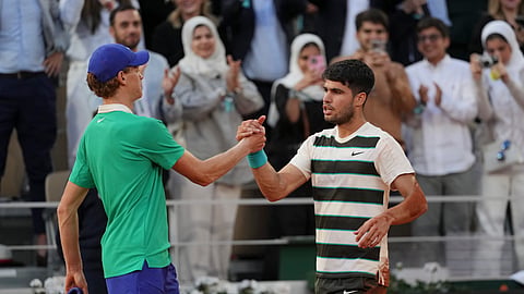 Winner Spain's Carlos Alcaraz, right, and Italy's Jannik Sinner shake hands after the final match of the French Tennis Open at the Roland-Garros stadium in Paris, Sunday, June 8, 2025. 