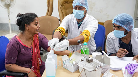 A relative of  Air India plane crash victim gives her DNA sample for identification of bodies at a hospital, in Ahmedabad, Friday, June 13, 2025. 