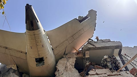 The tail of the Air India AI171 plane after it crashed in a residential area near the airport in Ahmedabad on Thursday, June 12, 2025. 