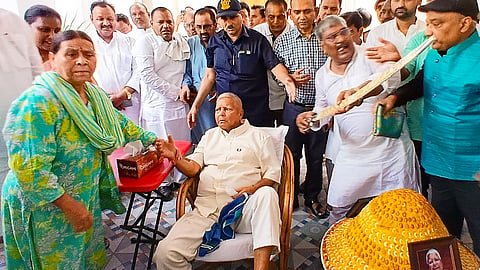  Rashtriya Janata Dal (RJD) supporters celebrate party chief Lalu Prasad Yadav�s 78th birthday with a 78 kg 'laddoo', in Patna, Wednesday, June 11, 2025. 