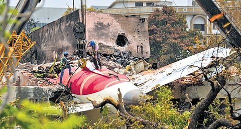 Cranes clearing the debris of the crashed Air India plane in Ahmedabad on May 14, 2025. 