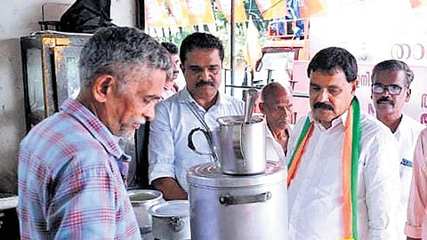 BJP candidate Mohan George interacts with voters during campaigning 