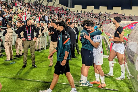 Palestinian players leave the field after an Asian Group B World Cup qualifying soccer match against Oman at the King Abdullah II Stadium in Amman, Jordan on June 12, 2025. 