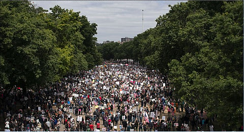People gather during a "No Kings" protest in Portland, Saturday, June 14, 2025 