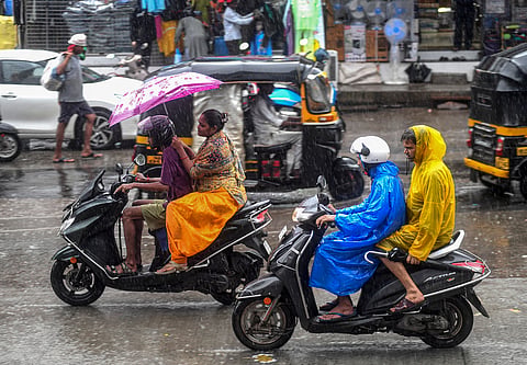 People commute amid rains, in Mumbai, Monday, June 16, 2025. 