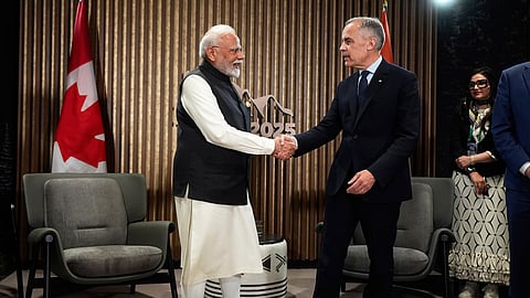India's Prime Minister Narendra Modi, left, and Canada's Prime Minister Mark Carney shake hands during a meeting at the G7 Summit in Kananaskis, Alberta, Tuesday, June 17, 2025. 