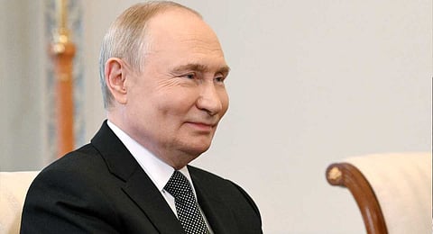 Russia's President Vladimir Putin reacts as he meets the President of the New Development on the sidelines of the Saint Petersburg International Economic Forum (SPIEF) in Saint Petersburg on June 18, 2025. 