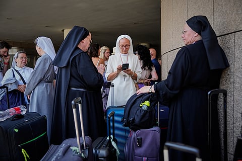 Nuns are among citizens of Poland and Austria assembled at a hotel in Tel Aviv, Israel, for evacuation amid heavy strikes on Israel by Iran Tuesday, June 17, 2025. 