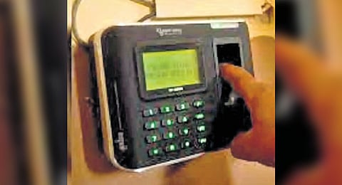 Image of a biometric attendance system used for representative purpose. 