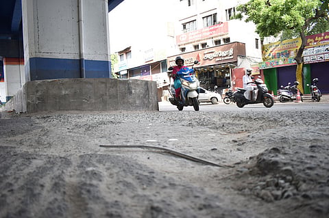Coimbatore: Iron rods exposed from the road are lying loose near the U-turn on Trichy Road at Olympus in Coimbatore, posing a risk to motorists. 