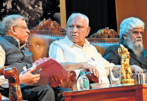 Senior BJP leader BS Yeddiyurappa with senior journalist S Gurumurthy (left) during a programme to mark 50 years of Emergency, in Bengaluru. 