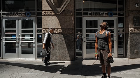 A man squints at the sun during a heat wave on Tuesday, June 24, 2025, in New York. 