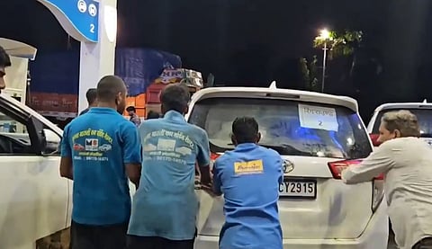 Cars from MP CM Mohan Yadav's convoy being pushed after 19 vehicles stalled after getting adulterated diesel from a local petrol pump.