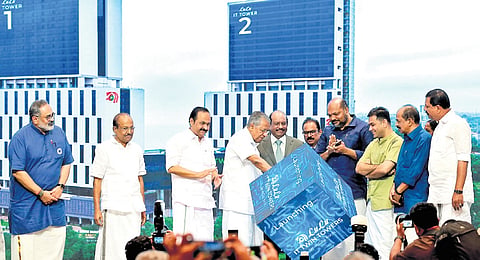Chief Minister Pinarayi Vijayan inaugurating the LuLu IT Twin Towers at SmartCity in Kochi on Saturday. LuLu Group Chairman Yusuffali M A, Leader of Opposition V D Satheesan, Ministers P Rajeev and G R Anil, MP Hibi Eden, MLA P K Kunhalikutty, and BJP state president Rajeev Chandrasekhar are also seen 