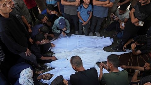 Relatives mourn over the bodies of family members who were killed, along with others, in Israeli strikes on the Gaza Strip, at Al-Shifa Hospital in Gaza City, Saturday, June 28, 2025. 