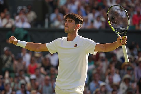 Carlos Alcaraz of Spain celebrates after beating Fabio Fognini of Italy during their first round men's singles match at the Wimbledon Tennis Championships in London, Monday, June 30, 2025. 