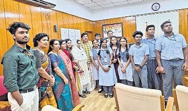 Chinmaya Vidyalaya team and Techosa officials  with Minister Ganesh Kumar