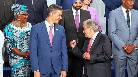 Spain's Prime Minister Pedro Sanchez, left, speaks with United Nations Secretary-General Antonio Guterres, as they pose for a photo with nation leaders and representatives, at the start of the four-day Financing for Development meeting, in Seville, Spain, Monday, June 30, 2025. 