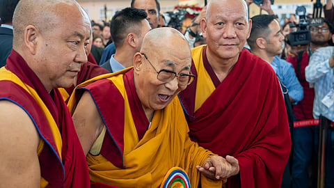 Attendant monks help Tibetan spiritual leader the Dalai Lama to leave after presiding over an event celebrating his 90th birthday according to a Tibetan calendar at the Tsuglakhang temple in Dharamshala, India, Monday, June 30, 2025, ahead of his birthday according to the Gregorian calendar on July 6. 