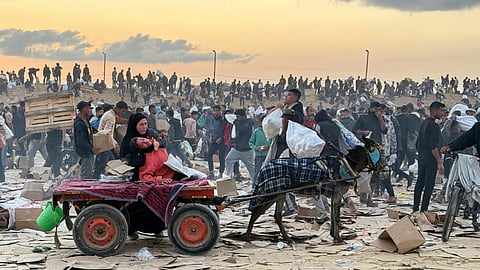This photo, provided by an American contractor on condition of anonymity because they were revealing their employers’ internal operations, shows a woman slumped over in a donkey cart after the contractor said she was hit in the head with part of a stun grenade at a food distribution site in Gaza run by the Gaza Humanitarian Foundation in June 2025.