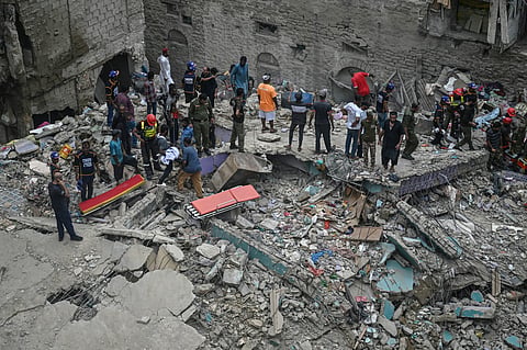 A rescue operation is underway at the site where a residential building collapsed in Karachi on July 4, 2025. A five-storey building collapse in Pakistan on July 4 killed at least five people and left six injured, with more victims trapped under the rubble, police said. 