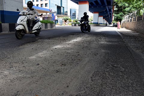 Damaged roads near Sungam bus stop on Tiruchy road in Coimbatore city.