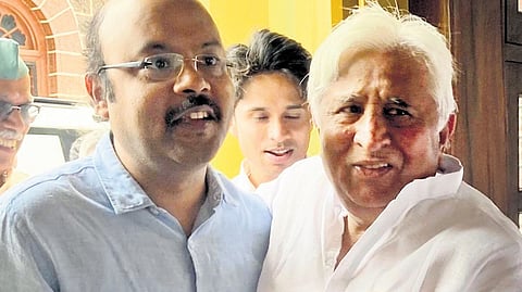 Law and Parliamentary Affairs Minister HK Patil and Congress MLC Dr Yathindra Siddaramaiah greet each other in Gadag on Sunday.