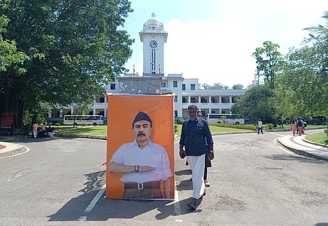   On Monday, activists from the SFI erected a billboard at the Kerala University headquarters in Thiruvananthapuram, depicting Vice Chancellor Mohanan Kunnummal in the attire of an RSS worker.