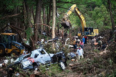 First responders carry out search and rescue operations near the Guadalupe River after a flash flood swept through the area, Monday, July 7, 2025, in Ingram, Texas. 