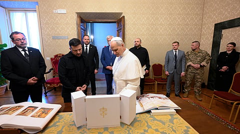 This handout photo taken and released on July 9, 2025 by The Vatican Media shows Pope Leo XIV meeting with Ukraine's President Volodymyr Zelensky at the papal residence of Castel Gandolfo, southeast of Rome. 