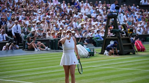 Amanda Anisimova of the US reacts after beating Aryna Sabalenka of Belarus in a women's singles semifinal match at the Wimbledon Tennis Championships in London, Thursday, July 10, 2025.