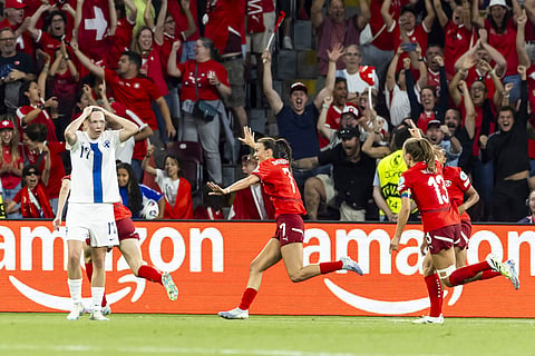 Switzerland's Riola Xhemaili, center, celebrates after scoring her side's goal during the UEFA Women's EURO 2025, group A, soccer match between Finland and Switzerland in Geneva, Switzerland, Thursday, July 10, 2025. 