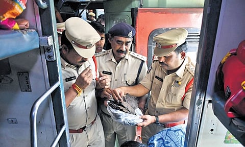  EAGLE team checks for illegal substances in a train at Vijayawada railway station on Thursday. 