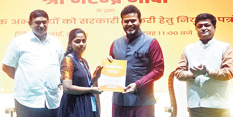 Civil Aviation Minister Kinjarapu Ram Mohan Naidu handing over the appointment letters to candidates at the 16th Rozgar Mela in Visakhapatnam | G Satyanarayana
