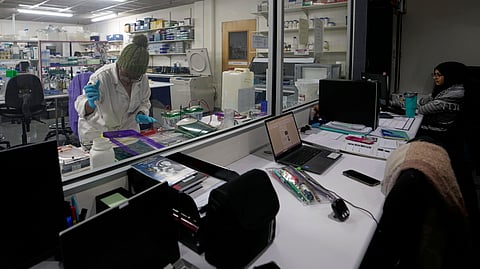 A laboratory technician Nozipho Mlotshwa works on samples at the Wits laboratory Antiviral Gene Therapy Research Unit, at University of the Witwatersrand Medical School, in Johannesburg, South Africa, Thursday, May 22, 2025.