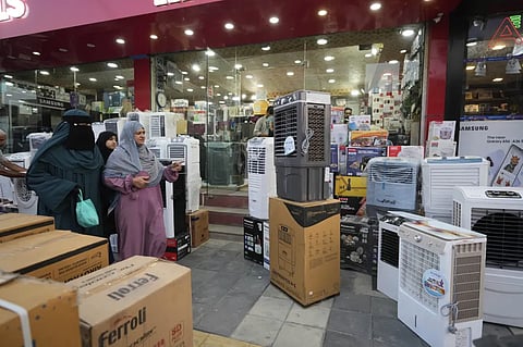 People purchase air conditioners at a shop on a hot summer day in Srinagar, Indian-controlled Kashmir, June 24, 2025. 