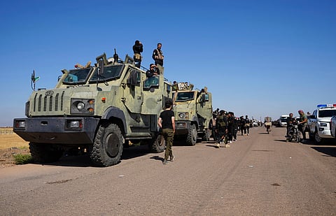 Syrian government security forces gather on the outskirts of Sweida province where clashes erupted between Druze militias and Sunni Bedouin clans, southern Syria, Monday, July 14, 2025. 