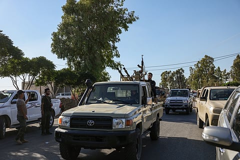 Members of Syria's security forces patrol an area between Mazraa and Walga near the predominantly Druze city of Sweida on July 14, 2025, following clashes between Bedouin tribes and Druze fighters. 