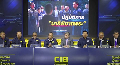 A screengrab made from the livestream of Thailand's Central Investigation Bureau holding a press conference in Bangkok, on Tuesday, July 15, 2025, about the arrest of a woman involved in a sex scandal that caused several senior monks to leave monkhood. 