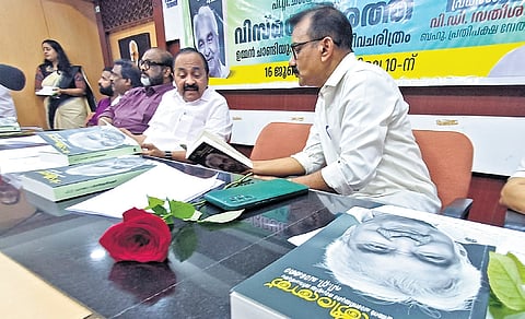 P T Chacko, former press secretary to Oommen Chandy, with Leader of Opposition V D Satheesan during the release of his book in Thiruvananthapuram on Wednesday. CMP general secretary C P John and film producer Renjith are also seen 