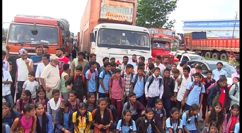 The Students and villagers of Konduskoppa village block
the national highway demanding  bus service to their village.