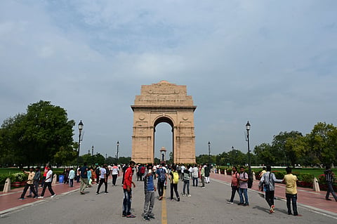 People visit the lawns of the Kartavya Path near India Gate in New Delhi. 