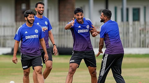 Mohammed Siraj shares a light moment with his teammates on Thursday